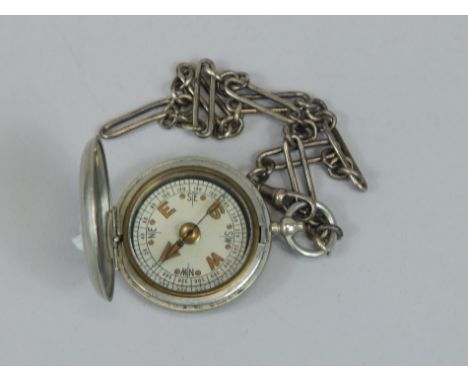 A World War I silver plated military compass, stamped F Darton & Co, London, and dated 1917, sold with a silver plated watch 