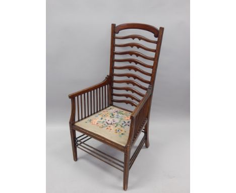 A Victorian mahogany and satinwood banded open armchair, with ladder back, and a needlework embroidered seat, on square taper