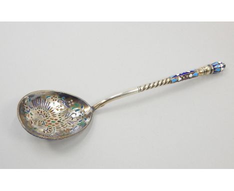 A Russian white metal champleve enamel spoon, the reverse of the bowl decorated with an eagle type crest, flowers, leaves etc