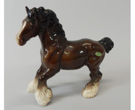 A Beswick ceramic model of a cantering horse, in brown, 22cm high