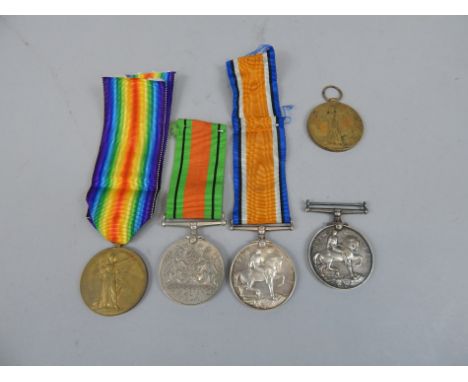 Four First World War medals and a Second World War medal, various recipients.