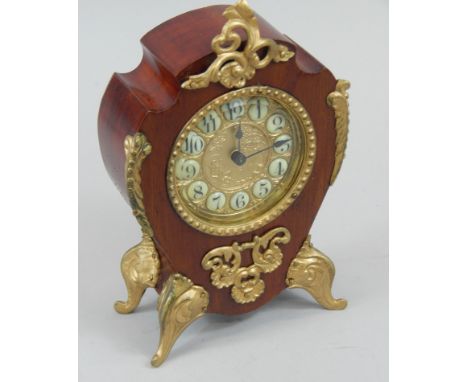 A 20thC mahogany and gilt metal Continental style mantel clock, ivorine label to reverse for Charles L Reis & Co, Birmingham,