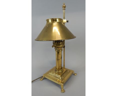 A reproduction brass Orient Express table lamp, with shade, 46cm high Provenance: Butterfields, Thoresby Park, Nottinghamshir