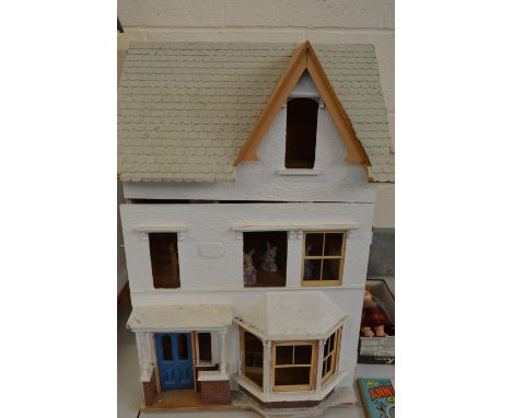 A WOODEN DOLLS HOUSE, in the form of a Victorian/Edwardian villa, front and roof opening to reveal four rooms and landing ove