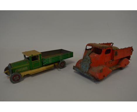 A TINPLATE CLOCKWORK TIPPER LORRY, lithographed green and cream livery with blue driver, red wheels and grey tyres, permanent