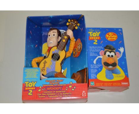 A BOXED MATTEL DISNEY PIXAR TOY STORY 2 STRUMMIN' SINGIN' WOODY FIGURE, No.23726, with a boxed Hasbro Playskool Mr Potato Hea