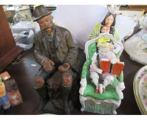 Four novelty tobacco jars, formed as a seated Indian, a figure in brown cloak, a child seated on a green chair and a seated m