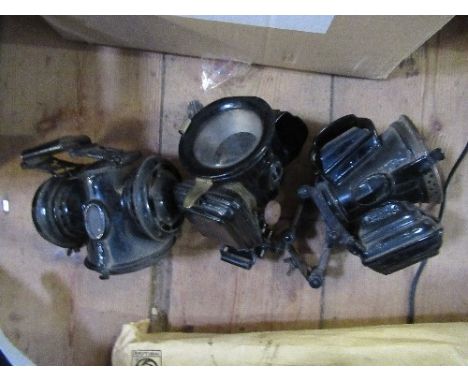A Lucas Silver King of the Road bike lamp, together with a Millers Lito lamp, another lamp, various car brochures and plastic