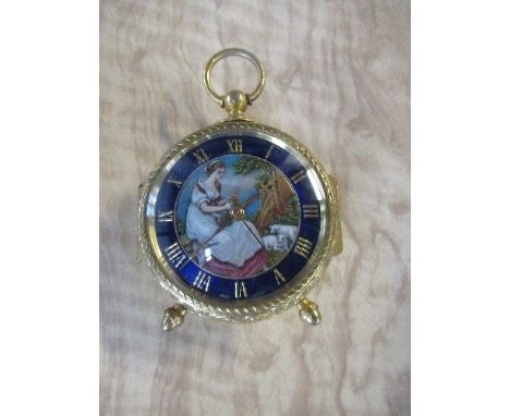 A modern Swiss travelling clock, the face decorated with a girl seated below a tree, max height 4ins