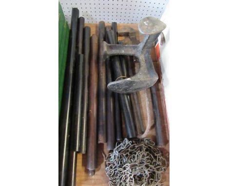 A collection of cylindrical rules, clock chain, shoe last and other tools