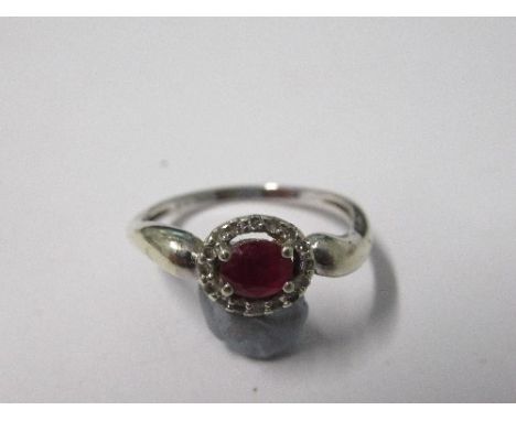 A ruby and diamond cluster ring, stamped '373' to the white mount, finger size P, 2g gross