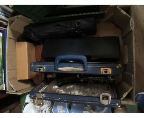 A box of musical instruments, to include Hohner harmonica, Buffet Cooper flute, and Boosey and Hawkes clarinet, etc