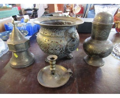 A brass jardinere, with pierced and engraved decoration, raised on paw feet, together with two Eastern brass pierced items an