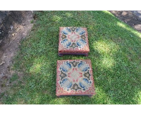 A pair of Victorian tapestry topped square foot stools, on mahogany bases with oblate bun feet, 13ins x 13ins, height 5.5ins