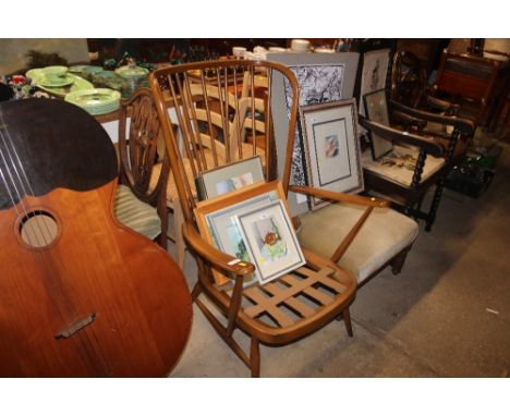 An Ercol stick back armchair (lacking cushions)