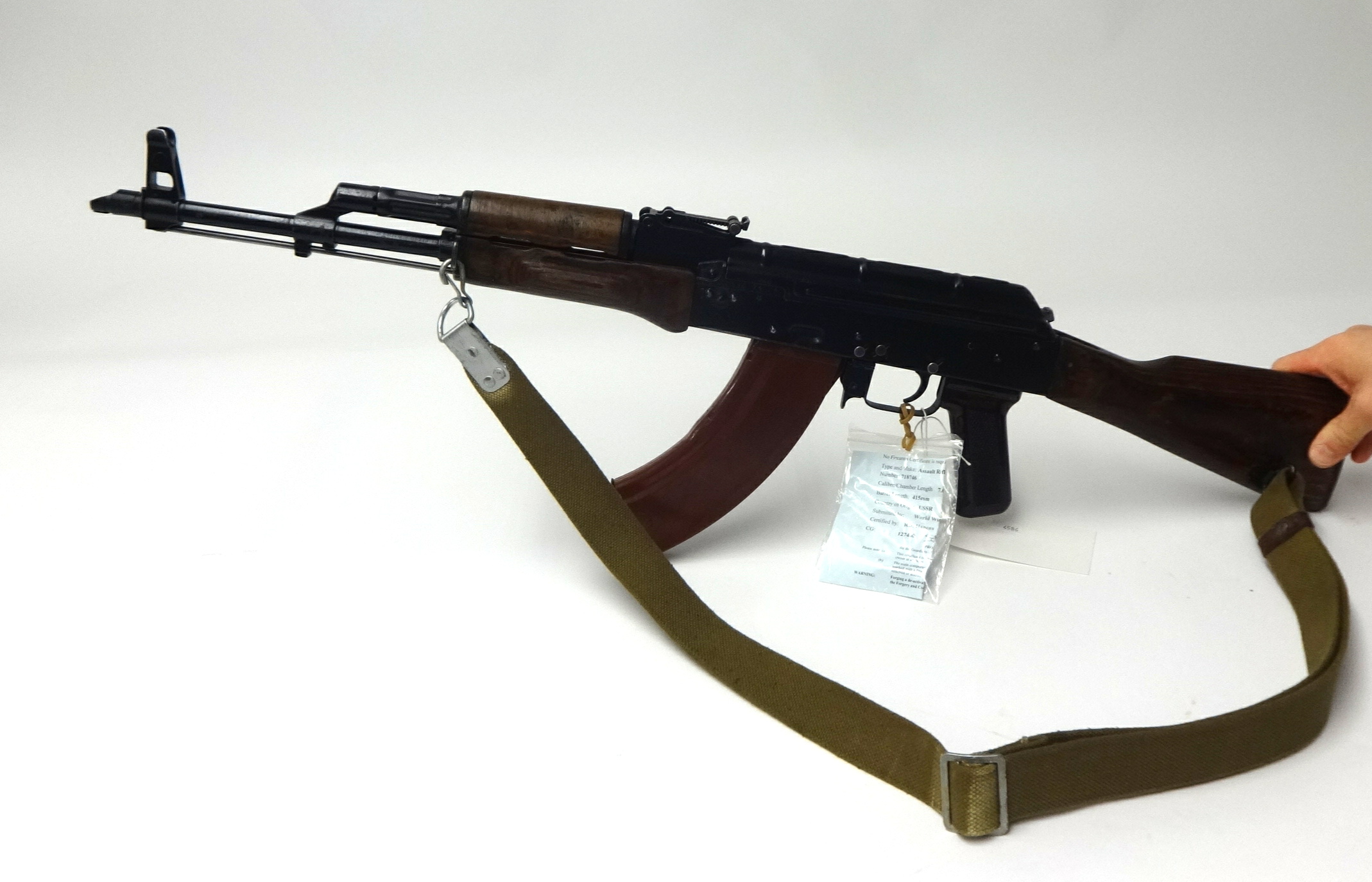 Deactivated; a Soviet Kalashnikov AKM assault rifle, number 718746 ...