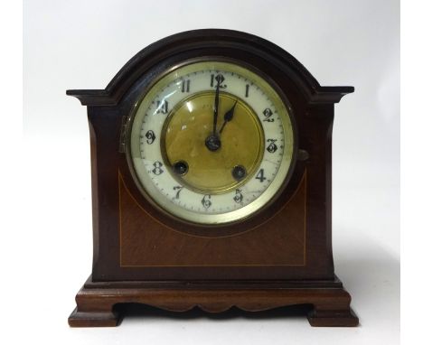 A mahogany bracket clock with striking eight day movement on a gong with pendulum, the arch top case with line inlay, height 