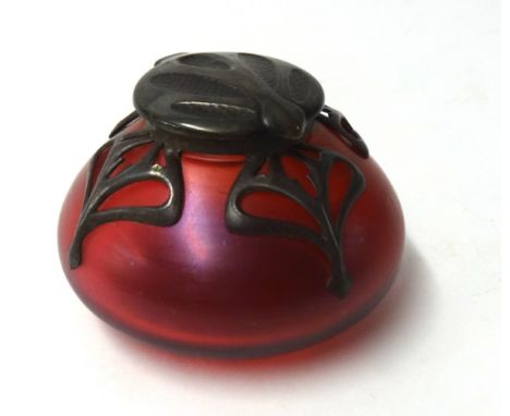 A coloured glass inkwell or scent bottle with Art Nouveau overlay pewter decoration , with embossed hinge lid.