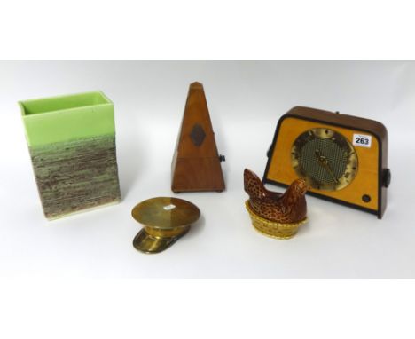 A French metronome of pyramid form, a Pye battery radio 'Slim Six', model P128B, circa 1960, trench art; a brass officers hat