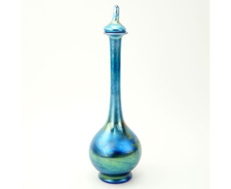 Steuben Aurene Iridescent Blue Bulbous Bottle With Stopper. Cut and polished pontil. The stopper appears to have been shorten