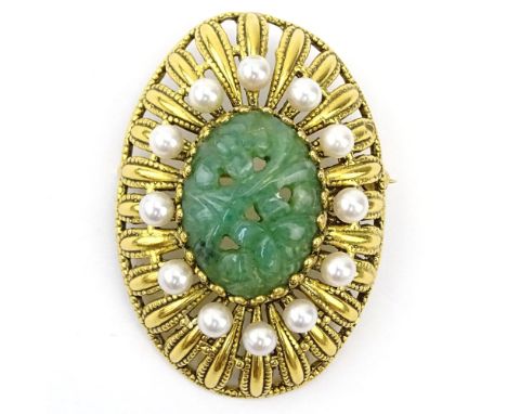 Vintage 14 Karat Yellow Gold, Carved Green Jade and Pearl Brooch. Unsigned. Good condition. Measures 1-3/4" L, 1-1/8" W. Appr