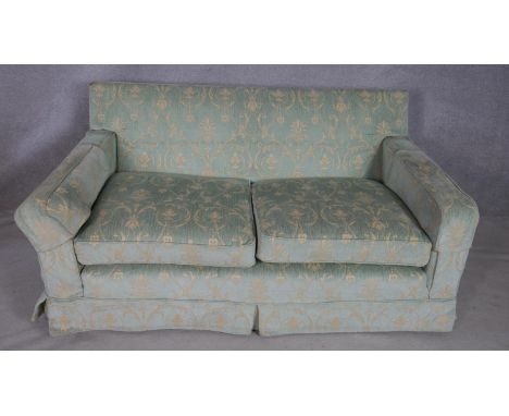 A floral upholstered two seater sofa. L.182.D94.H.80cm 