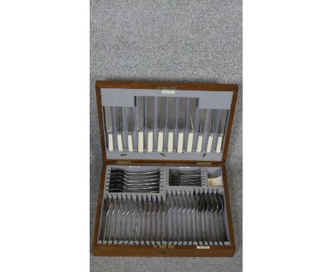 An oak cased vintage six person Walker &amp; Hall silver plated canteen. With makers plaque and name plaques. Brass shield sh