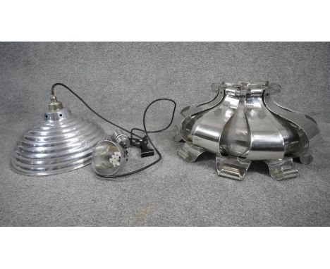 A vintage aluminium adjustable ceiling light and abstract design pendant lamp shade. The shade is composed of curled and rive