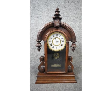 A late 19th century mahogany cased American mantel clock with eight day movement. With Key and pendulum. H.60 W.35 D.13cm