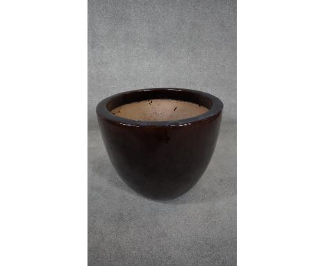 A large brown saltglaze ceramic planter. H.46 W.57cm 