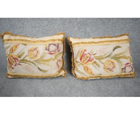 A pair of tapestry tulip design cushions with mustard fringing. Cream foliate design fabric to the reverse. H.35 W.48 D.35 