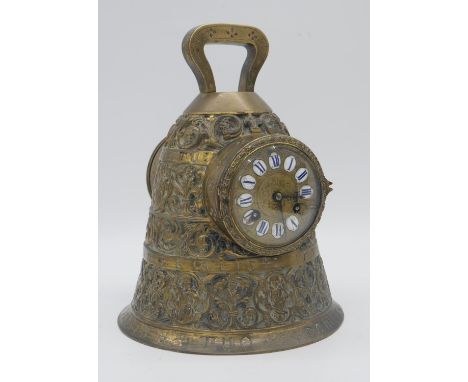 A 19th century French brass mantel clock modelled as a bell, the dial with enamel Roman numerals, the entire case ornately de