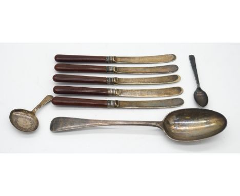 A collection of silver and silver plate cutlery Including a set of silver collared butter knives, a silver serving spoon and 