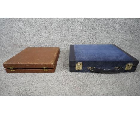 Two vintage cased gaming boards. One travelling chess set in brown leather effect case and a backgammon set in blue leather e