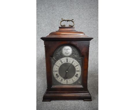 A modern 18th century style bracket clock, the dial inscribed 'Tempus Fugit', with Roman numerals and brass carrying handle. 