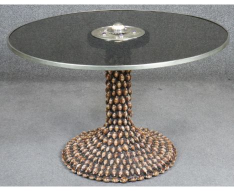 Anthony Redmile, a glass topped table with ivory and amethyst inlay to the top and cowrie shells to the base, stamped J Anton