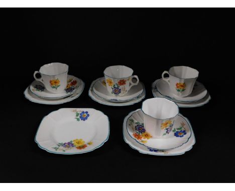 A Melba porcelain part tea service, printed with flowers, comprising four cups and saucers, and five tea plates.