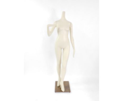 A mid 20thC cream painted female mannequin, raised on steel base, 174cm high.