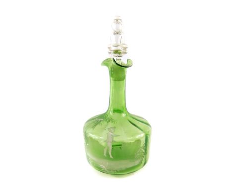 A Mary Gregory type late 19th green glass carafe and stopper, decorated with a boy playing in a garden, 26cm high.