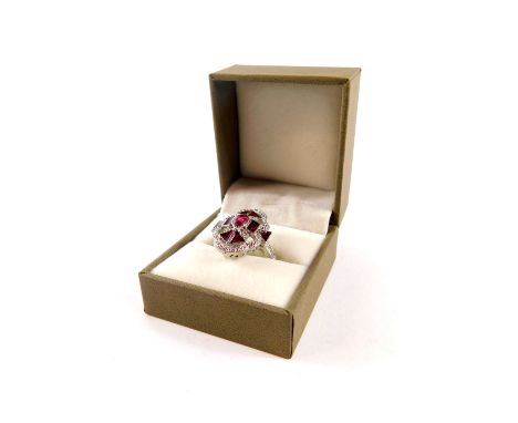 A ruby red enamel and paste set ring, of oblong form, boxed, size P.