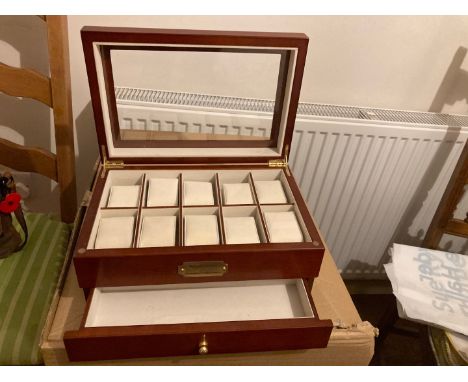 A quality rosewood finish watch / jewellery box, with glazed lid and individual padded compartments for your precious jewels 