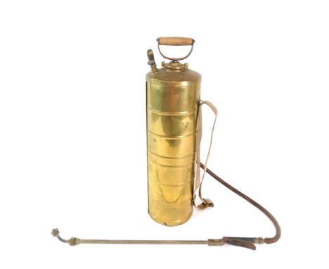 A vintage brass garden sprayer, by The Eclipse Spraying Company of Smethwick, 69cm high.