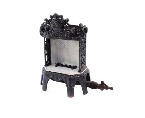 A German cast iron and enamel mantle heater, circa 1890's, by Welsbach Kern, No 17a, with floral and foliate cast side panels