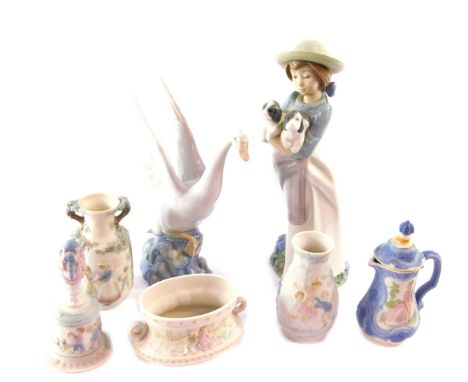 A group of Lladro bisque porcelain ornaments, comprising a bell, three vases and a jug and cover, together with a Nao porcela