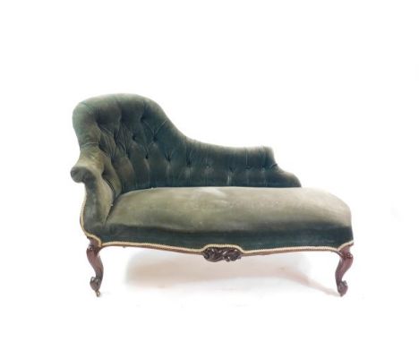 A Victorian mahogany chaise longue, upholstered in green button back velvet, raised on cabriole legs, on castors, 153cm wide.