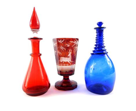 An early 20thC Bristol Blue glass bottle and stopper, with blue spiral twist overlay to the neck, 18cm high., cranberry glass