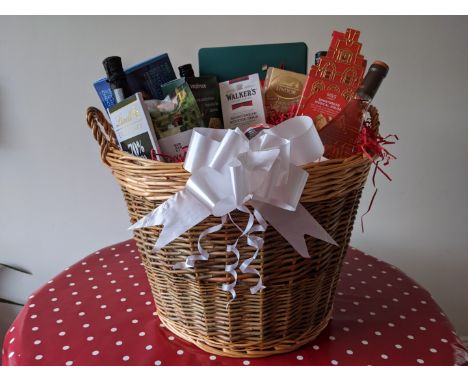 A large Christmas hamper, crammed with goodies to make your Christmas Day really special, all in a wicker log basket. Approx 