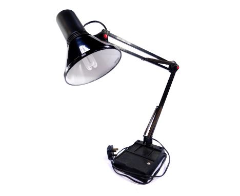 A black anglepoise type desk lamp, raised on a black plastic base, 75cm high extended.