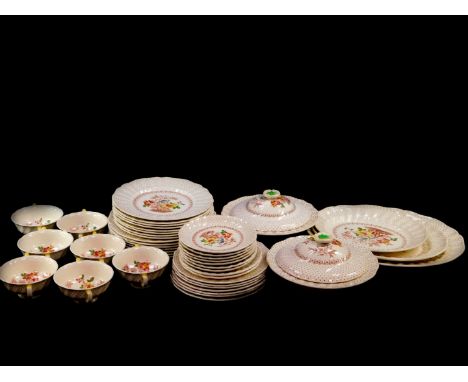 A Royal Doulton pottery part dinner service, decorated in the Grantham pattern, D5477, comprising three graduated meat platte