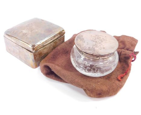 A George V cut glass toilet jar with silver lid, with engine turned decoration, oval reserve monogram engraved, Birmingham 19